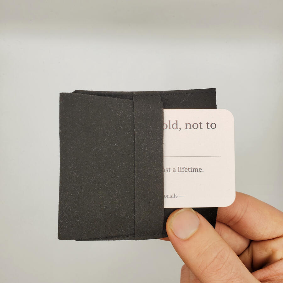 Untitled A closed pouch containing laser-engraved memorial keepsake key chains.